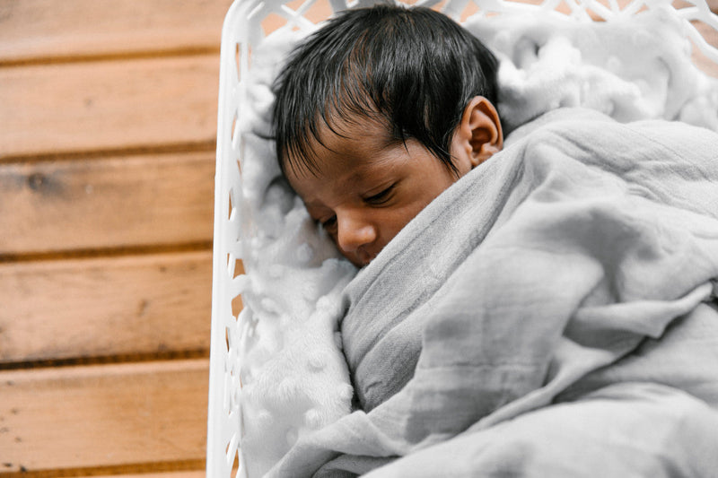 When is it safe for baby to sleep with a blanket?